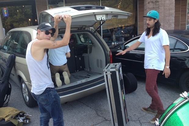 T. Hardy Morris and the Hardknocks load up the minivan that they use for short, regional tours. (Photo taken by the author.)