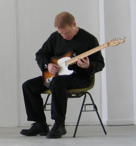 Pisaro performing on solo electric guitar. 