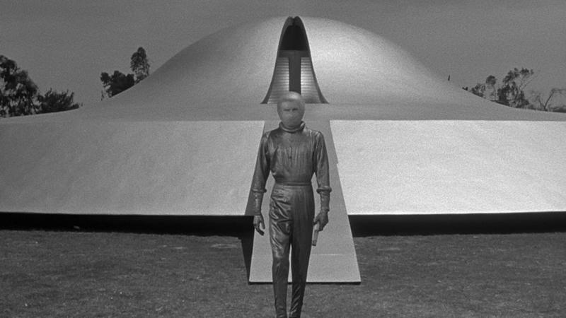 scifi, movie, 1950's, man infront of a spaceship