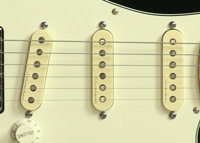 Three single-coil pickups on a Fender Stratocaster.
