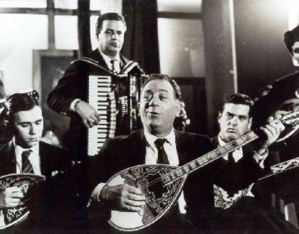 Giorgos Zambetas performing Rebetiko music with an ensemble