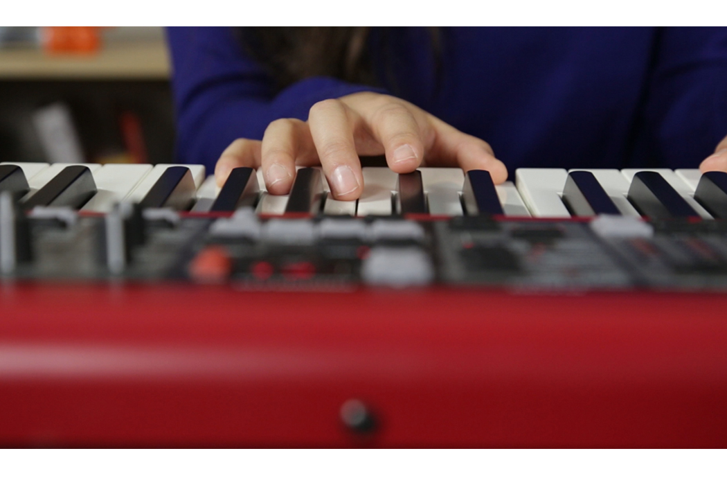 closeup hands on piano