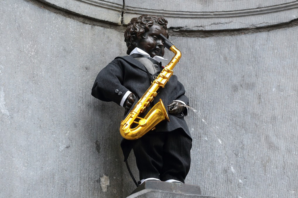All of the Times Manneken Pis Dressed Up Like a Musician (We Think!)
