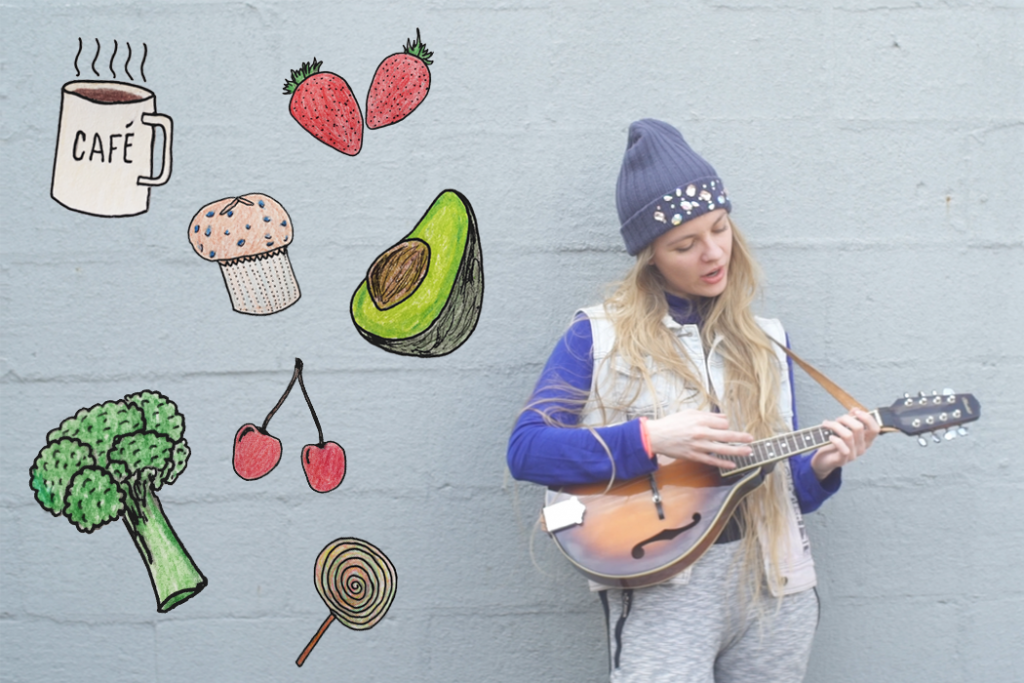woman with ukelele surrounded by foods