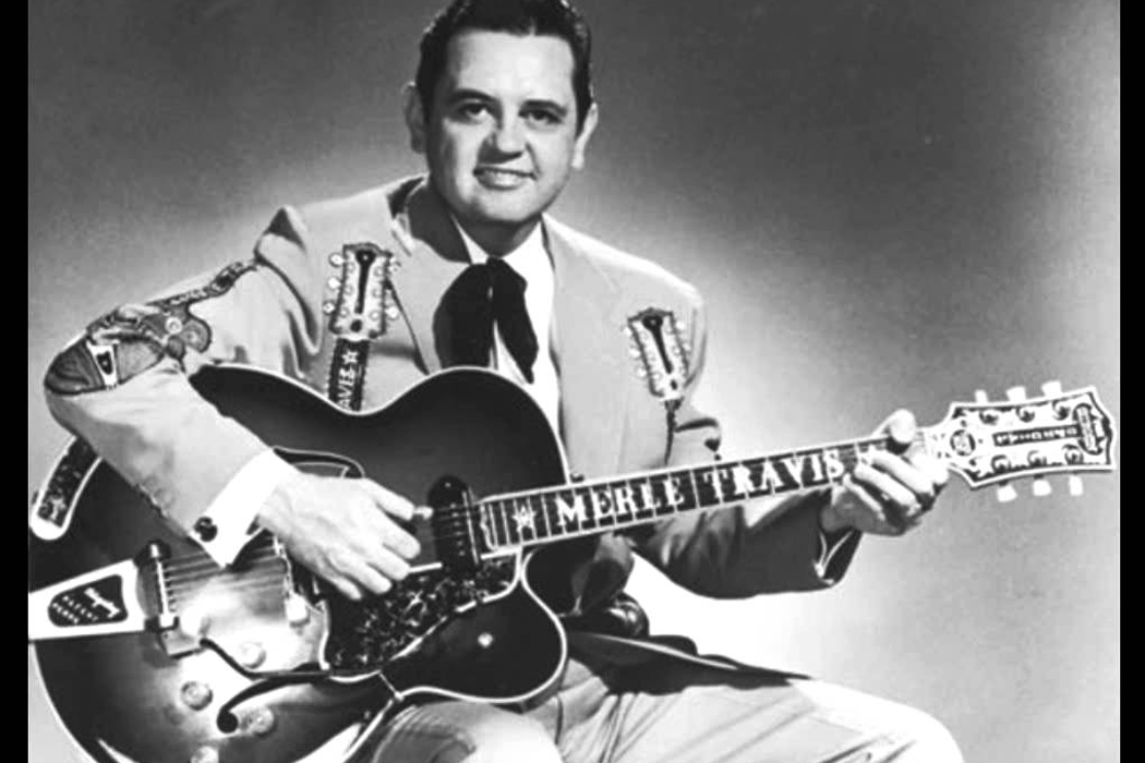 Merle Travis with his custom name-plated guitar. 