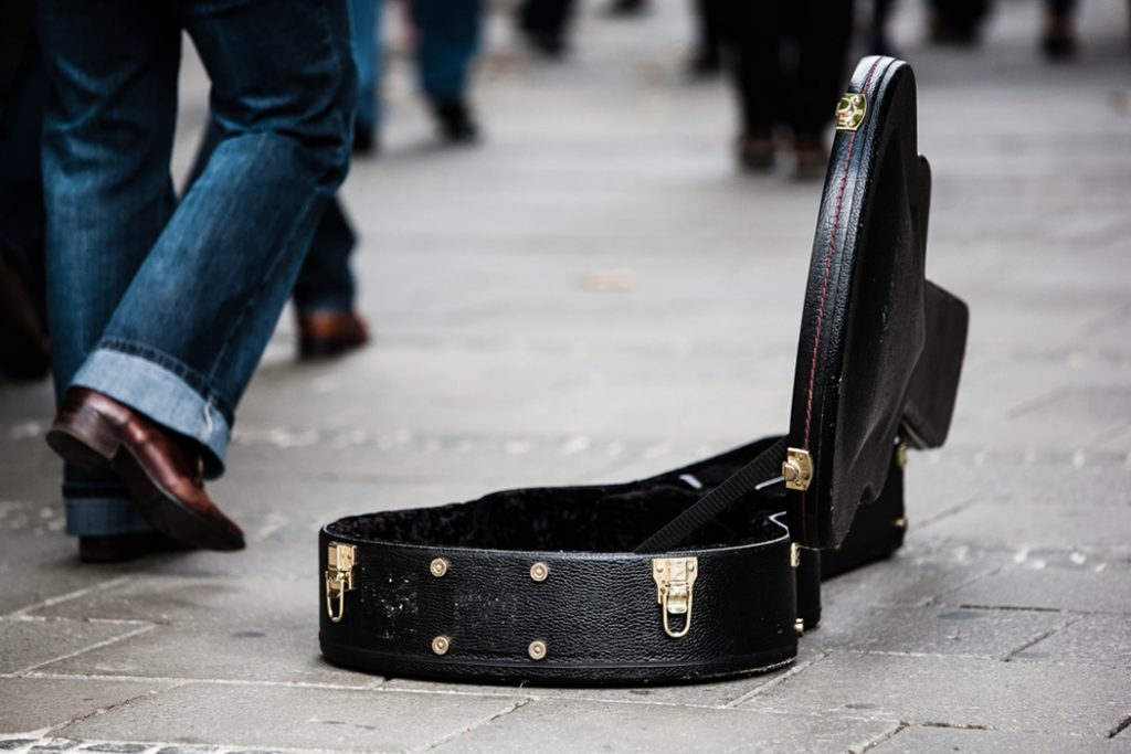 empty guitar case on the street