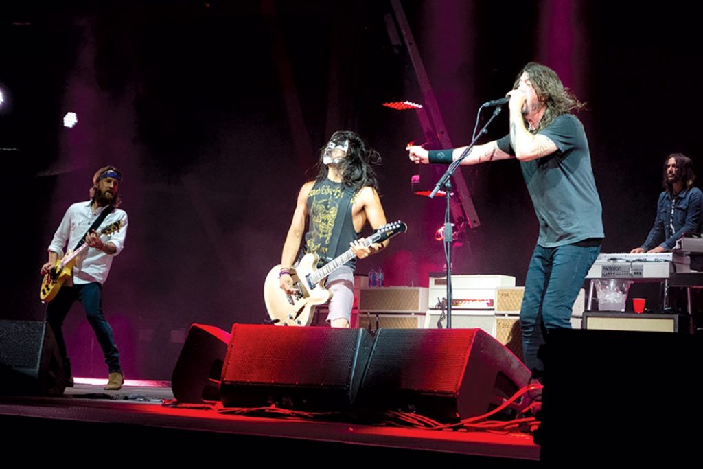 Foo Fighters on stage with fan