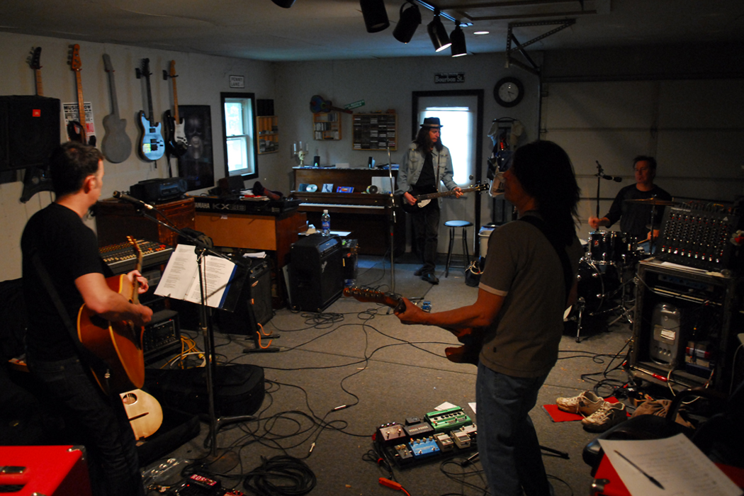 band rehearsing together in a room