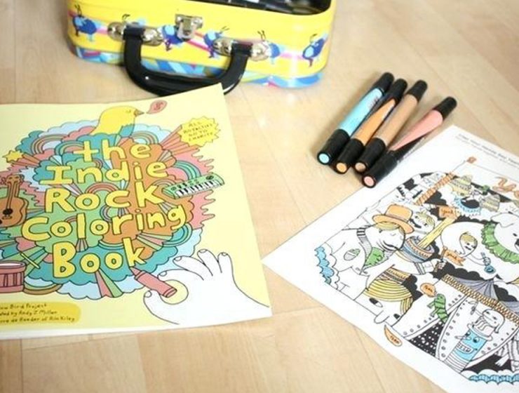 The Indie Rock Coloring Book, and pens on a table