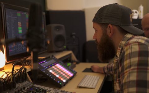 man producing electronic music