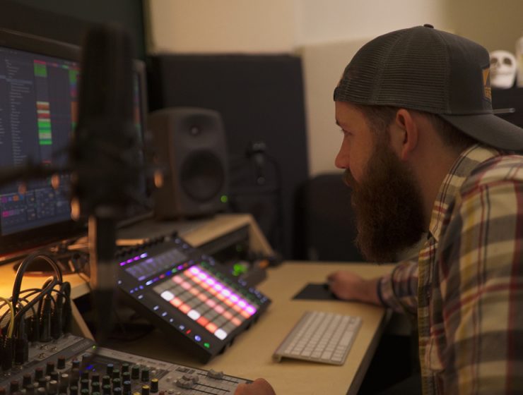 man producing electronic music