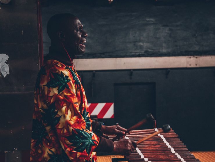 Man in robe playing marimba