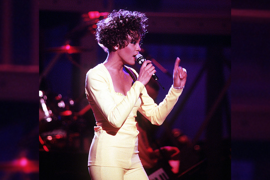 Whitney Houston singing on stage