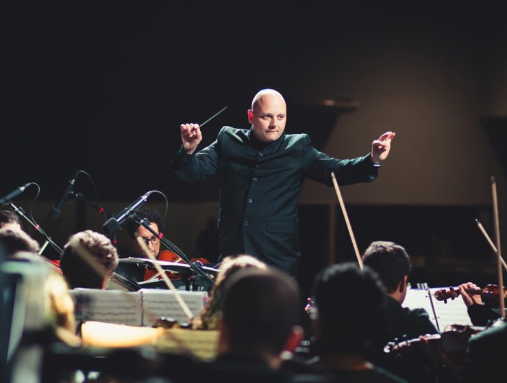 conductor directing an orchestra