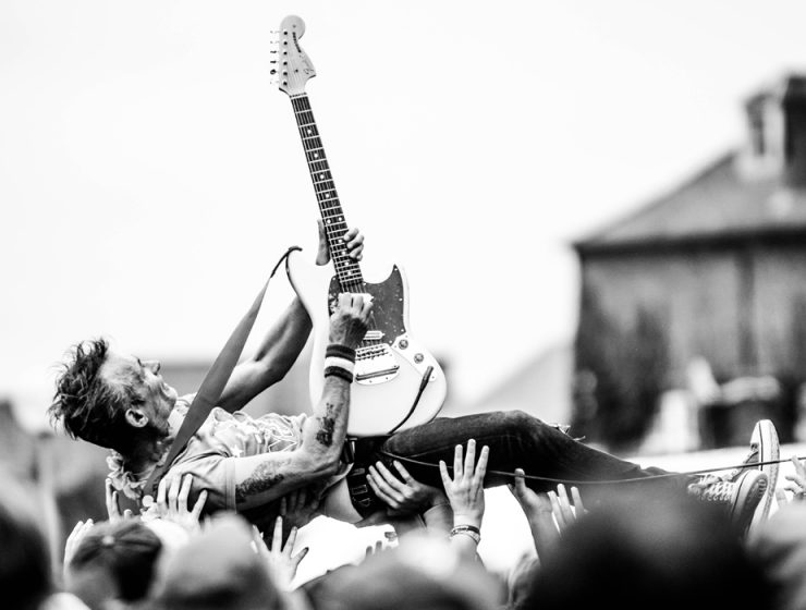 rock guitarist crowdsurfing