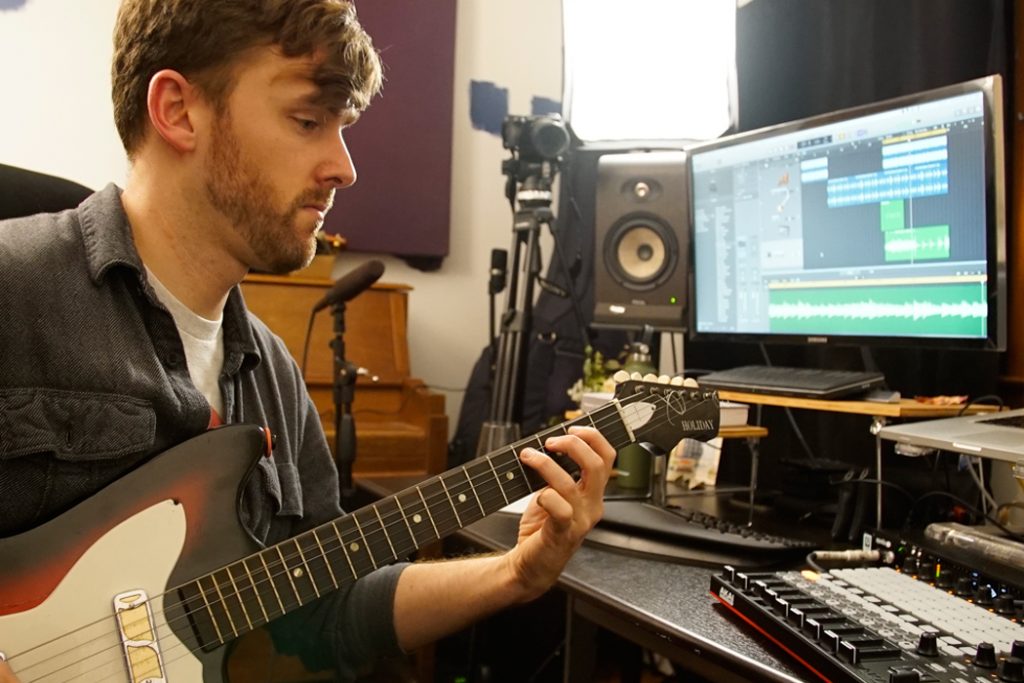 guitarist recording in Logic Pro