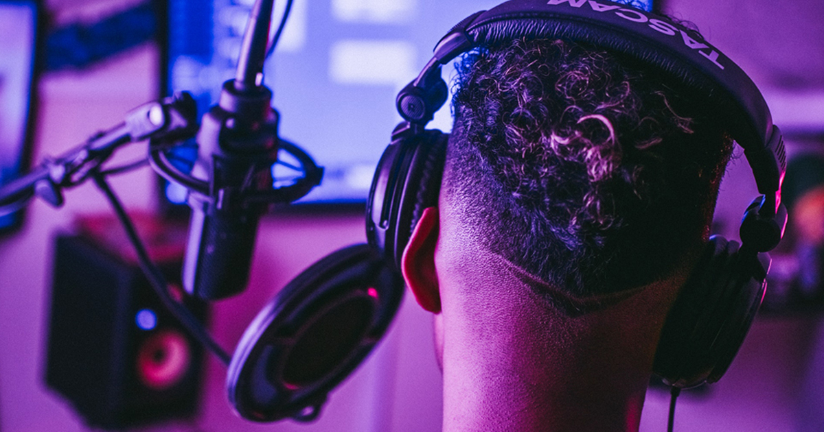 man recording music at home