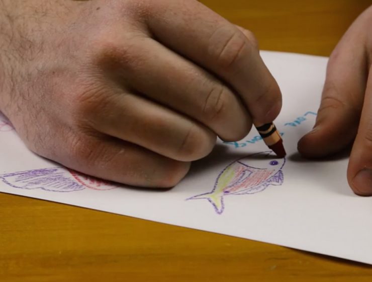 closeup of hands drawing