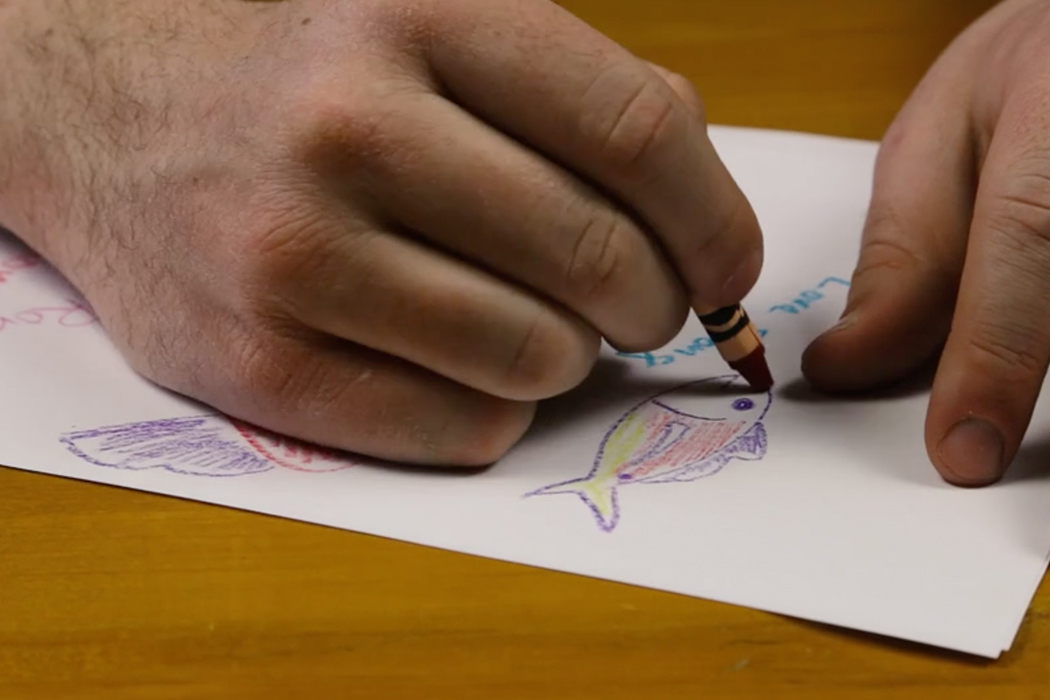 closeup of hands drawing