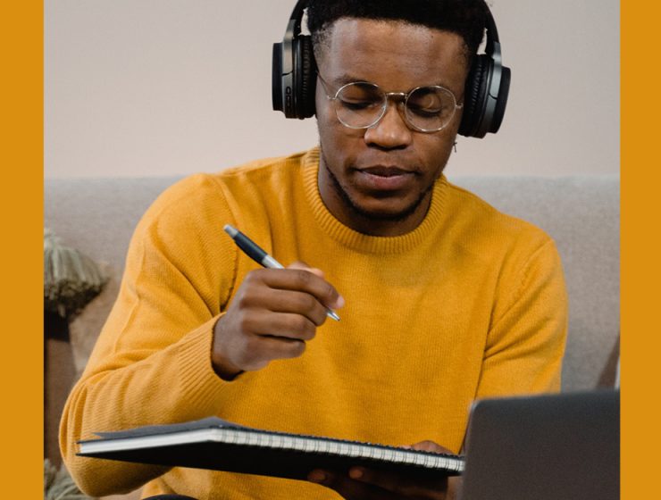man writing music