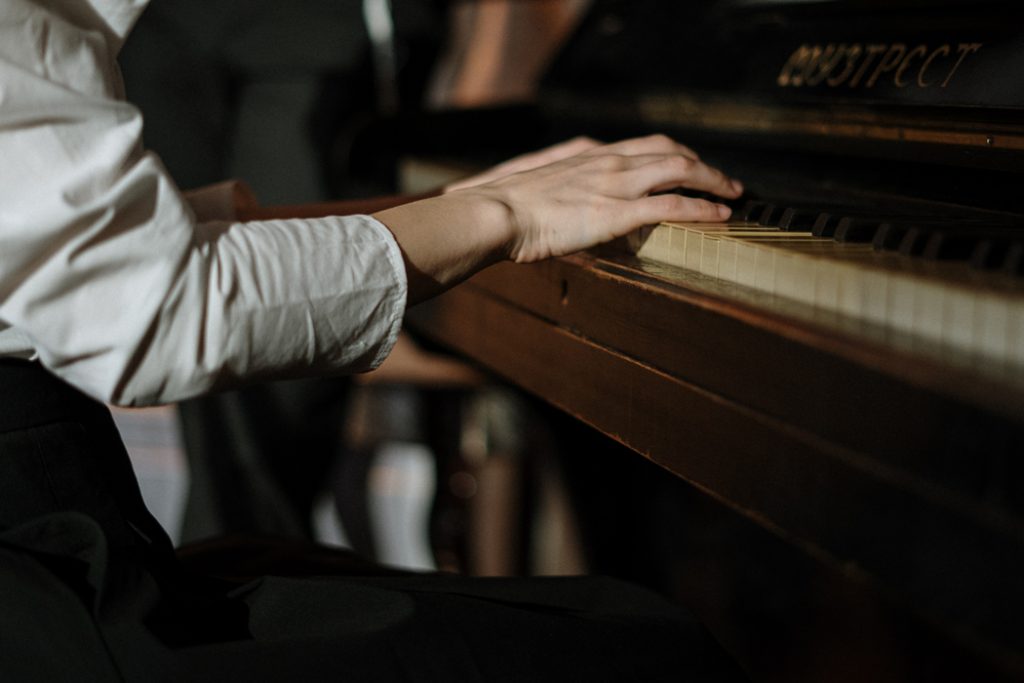closeup hands on piano