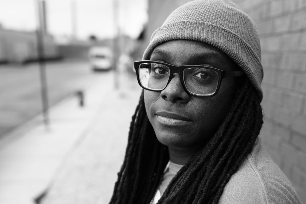 black and white photo of Jlin on the street