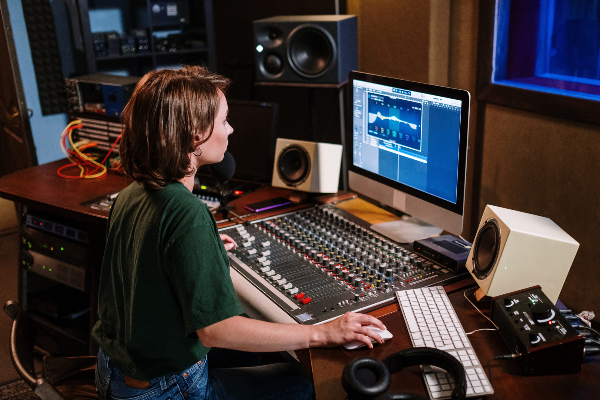 woman mixing audio in the control room