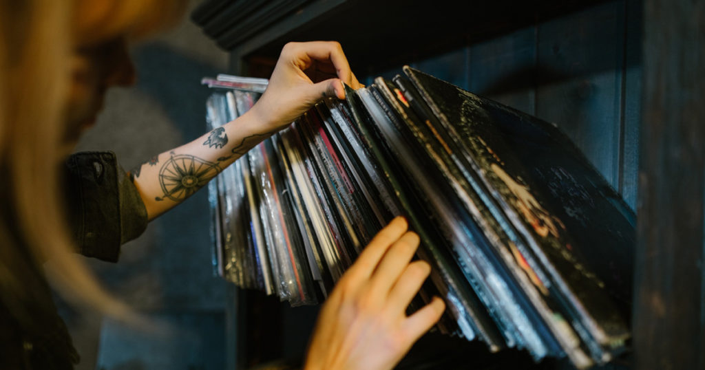 woman looking through records
