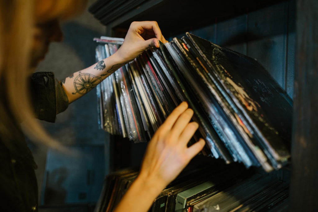 woman looking through records