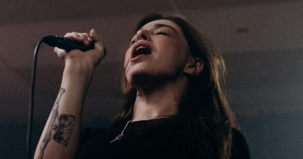 closeup photo of vocalist singing