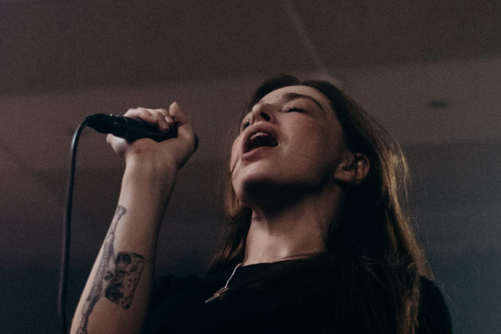 closeup photo of vocalist singing