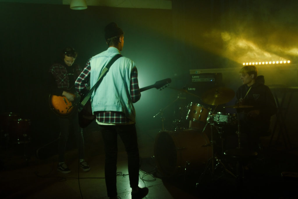 band playing in a dark room