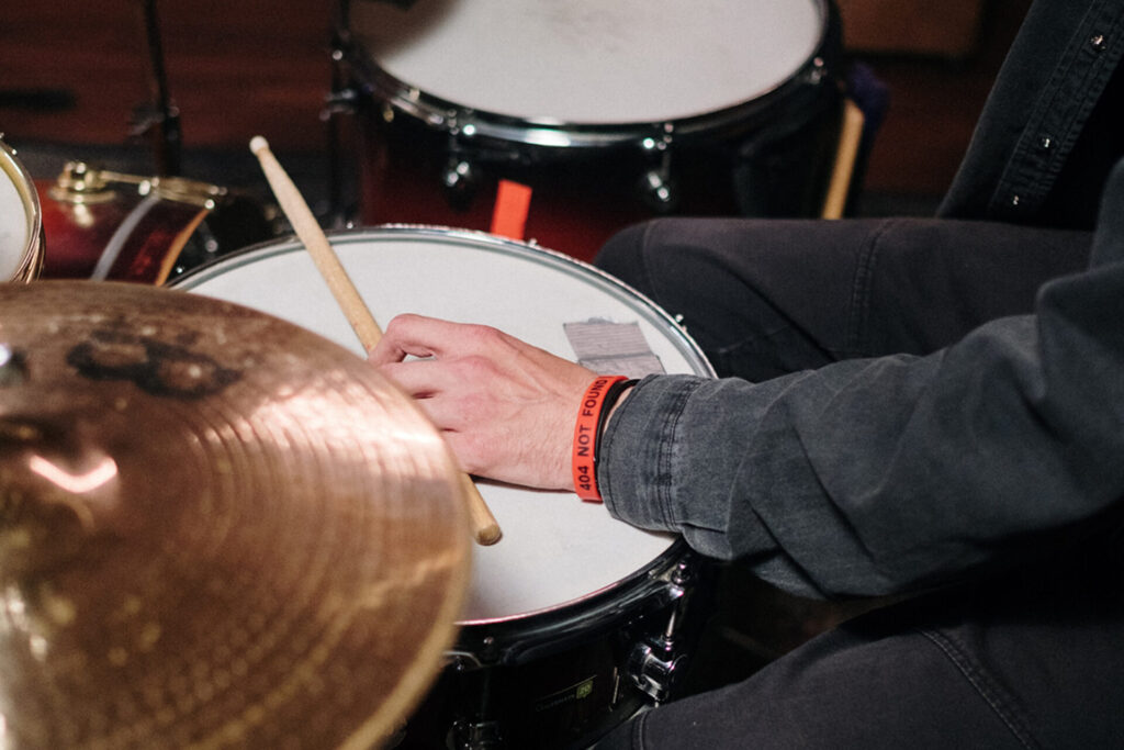 closeup photo of a drummer's hands